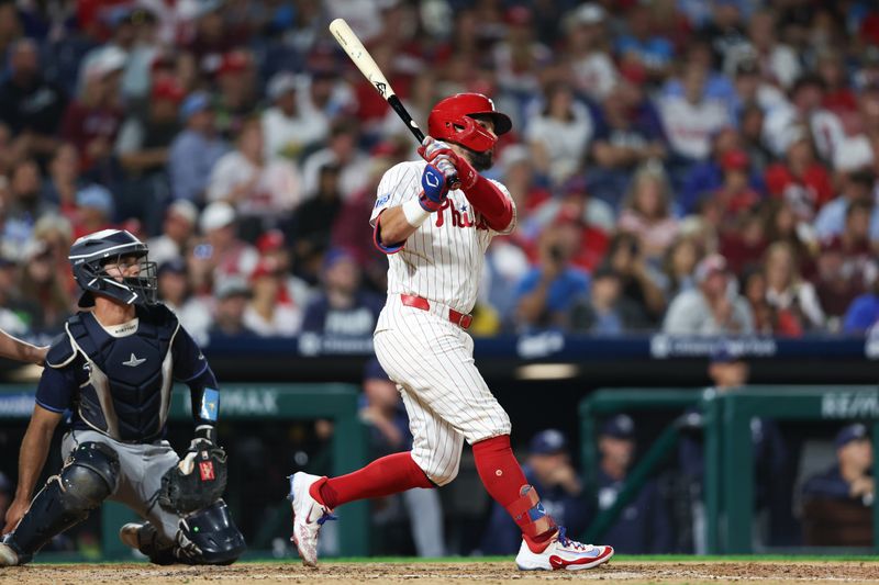 Sep 9, 2024; Philadelphia, Pennsylvania, USA; Philadelphia Phillies designated hitter Kyle Schwarber (12) hits a home run during the sixth inning against the Tampa Bay Rays at Citizens Bank Park. Mandatory Credit: Bill Streicher-Imagn Images