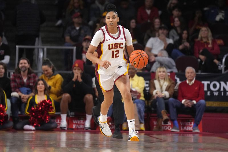 Dec 29, 2024; Los Angeles, California, USA; Southern California Trojans center Rayah Marshall (13) dribbles the ball against the Michigan Wolverines in the first half at Galen Center. Mandatory Credit: Kirby Lee-Imagn Images