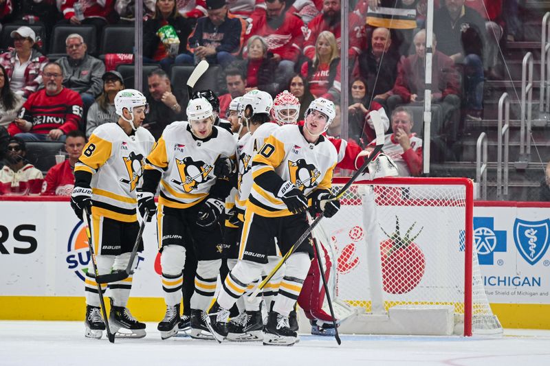 Oct 10, 2024; Detroit, Michigan, USA; Pittsburgh Penguins left wing Drew O'Connor (10) celebrates his goal with teammates during the second period against the Detroit Red Wings at Little Caesars Arena. Mandatory Credit: Tim Fuller-Imagn Images