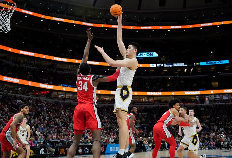 Mar 11, 2023; Chicago, IL, USA; Purdue Boilermakers center Zach Edey (15) is defended by Ohio State Buckeyes center Felix Okpara (34) during the first half at United Center. Mandatory Credit: David Banks-USA TODAY Sports