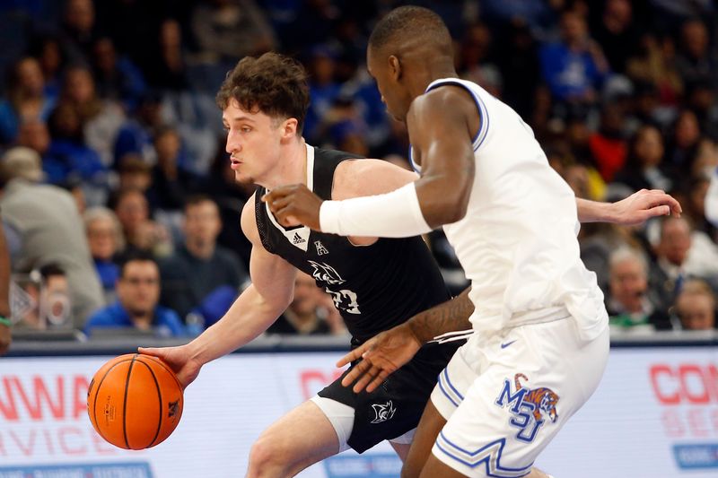 Jan 31, 2024; Memphis, Tennessee, USA; Rice Owls guard Alem Huseinovic (23) drives to the basket as Memphis Tigers forward David Jones (8) defends during the second half at FedExForum. Mandatory Credit: Petre Thomas-USA TODAY Sports