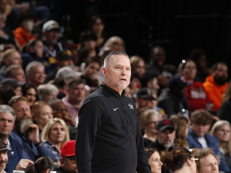 PORTLAND, OR - FEBRUARY 23: Head Coach Michael Malone of the Denver Nuggets looks on during the game against the Portland Trail Blazers on February 23, 2024 at the Moda Center Arena in Portland, Oregon. NOTE TO USER: User expressly acknowledges and agrees that, by downloading and or using this photograph, user is consenting to the terms and conditions of the Getty Images License Agreement. Mandatory Copyright Notice: Copyright 2024 NBAE (Photo by Cameron Browne/NBAE via Getty Images)