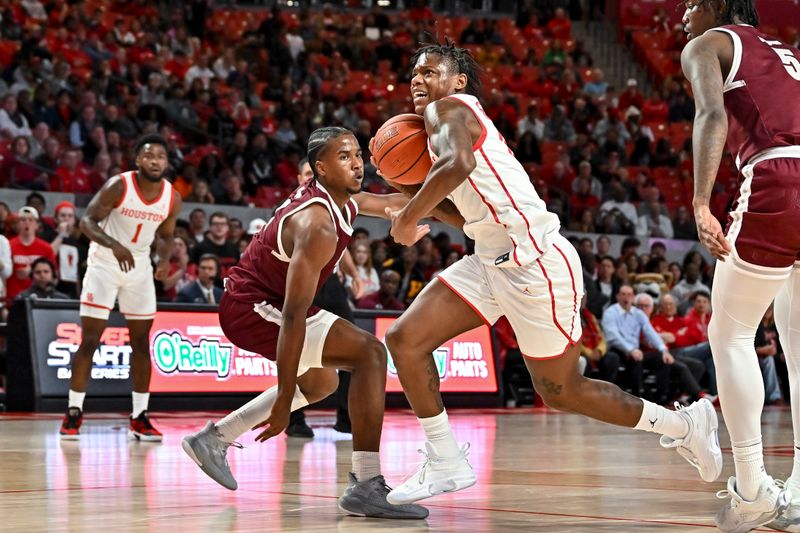 Nov 16, 2022; Houston, Texas, USA;  Houston Cougars guard Marcus Sasser (0) drives to the basket against the Texas Southern Tigers during the first half at Fertitta Center. Mandatory Credit: Maria Lysaker-USA TODAY Sports