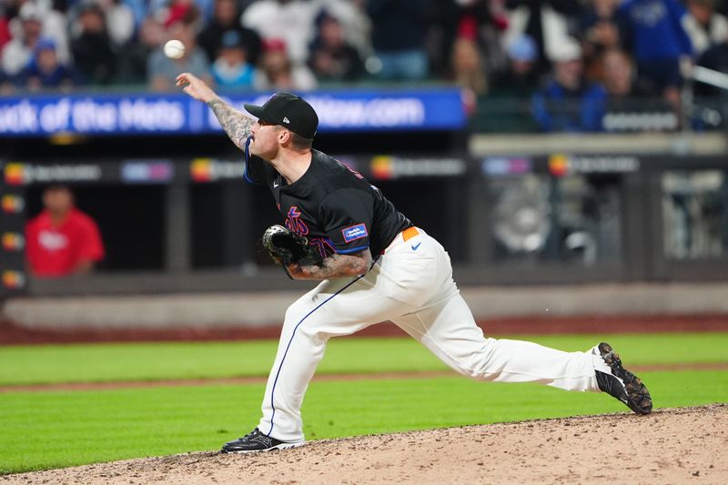 May 13, 2024; New York City, New York, USA; New York Mets pitcher Sean Reid-Foley (71) delivers a pitch against the Philadelphia Phillies during the tenth inning at Citi Field. Mandatory Credit: Gregory Fisher-USA TODAY Sports