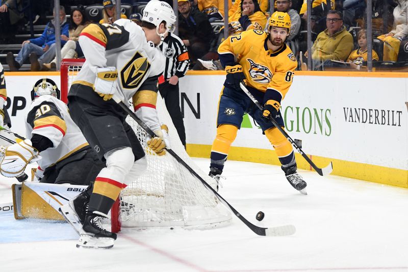 Mar 26, 2024; Nashville, Tennessee, USA; Nashville Predators center Tommy Novak (82) passes the puck during the first period against the Vegas Golden Knights at Bridgestone Arena. Mandatory Credit: Christopher Hanewinckel-USA TODAY Sports