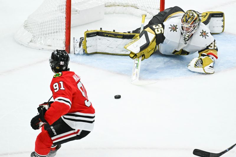 Jan 18, 2025; Chicago, Illinois, USA;  Vegas Golden Knights goaltender Ilya Samsonov (35) defends against Chicago Blackhawks center Frank Nazar (91) during the third period at United Center. Mandatory Credit: Matt Marton-Imagn Images