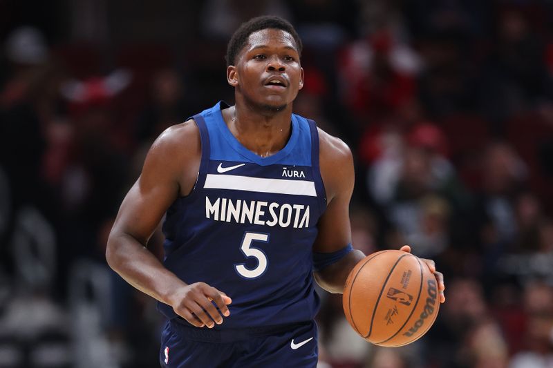 CHICAGO, ILLINOIS - OCTOBER 19: Anthony Edwards #5 of the Minnesota Timberwolves dribbles up the court against the Chicago Bulls during the first half of a preseason game at the United Center on October 19, 2023 in Chicago, Illinois. NOTE TO USER: User expressly acknowledges and agrees that, by downloading and or using this photograph, User is consenting to the terms and conditions of the Getty Images License Agreement.  (Photo by Michael Reaves/Getty Images)