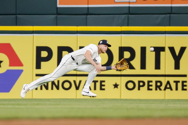 Apr 15, 2024; Detroit, Michigan, USA; Detroit Tigers center fielder Parker Meadows catches a fly ball against the Texas Rangers at Comerica Park. Mandatory Credit: Brian Bradshaw Sevald-USA TODAY Sports