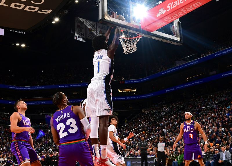 PHOENIX, AZ - NOVEMBER 18: Jonathan Isaac #1 of the Orlando Magic dunks the ball during the game against the Phoenix Suns on November 18, 2024 at Footprint Center in Phoenix, Arizona. NOTE TO USER: User expressly acknowledges and agrees that, by downloading and or using this photograph, user is consenting to the terms and conditions of the Getty Images License Agreement. Mandatory Copyright Notice: Copyright 2024 NBAE (Photo by Kate Frese/NBAE via Getty Images)