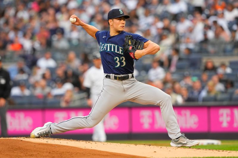 Jun 22, 2023; Bronx, New York, USA; Seattle Mariners pitcher Bryan Woo (33) delivers a pitch against the New York Yankees during the first inning at Yankee Stadium. Mandatory Credit: Gregory Fisher-USA TODAY Sports