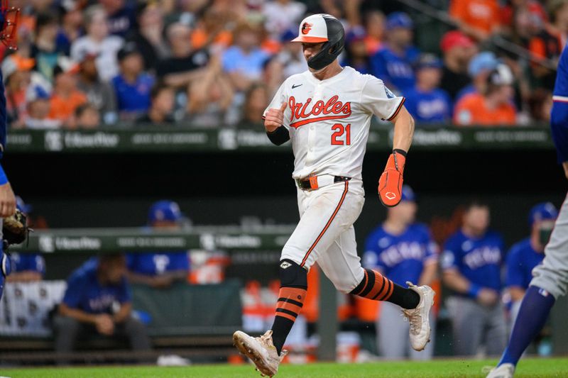 Jun 30, 2024; Baltimore, Maryland, USA; Baltimore Orioles outfielder Austin Hays (21) scores a run during the fourth inning against the Texas Rangers at Oriole Park at Camden Yards. Mandatory Credit: Reggie Hildred-USA TODAY Sports