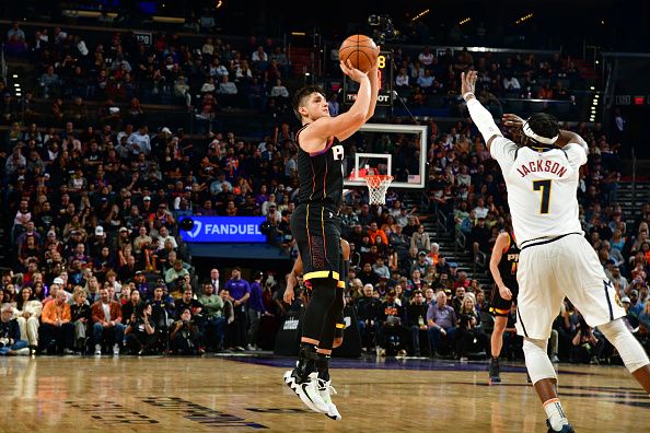 PHOENIX, AZ - DECEMBER 1: Grayson Allen #8 of the Phoenix Suns shoots the ball during the game against the Denver Nuggets on December 1, 2023 at Footprint Center in Phoenix, Arizona. NOTE TO USER: User expressly acknowledges and agrees that, by downloading and or using this photograph, user is consenting to the terms and conditions of the Getty Images License Agreement. Mandatory Copyright Notice: Copyright 2023 NBAE (Photo by Kate Frese/NBAE via Getty Images)