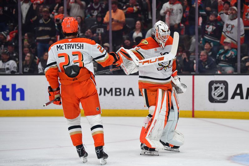 Jan 17, 2026; Anaheim, California, USA; Anaheim Ducks center Mason McTavish (23) celebrates his goal scored against the Los Angeles Kings with goaltender Ville Husso (33) during the first period at Honda Center. Mandatory Credit: Gary A. Vasquez-Imagn Images