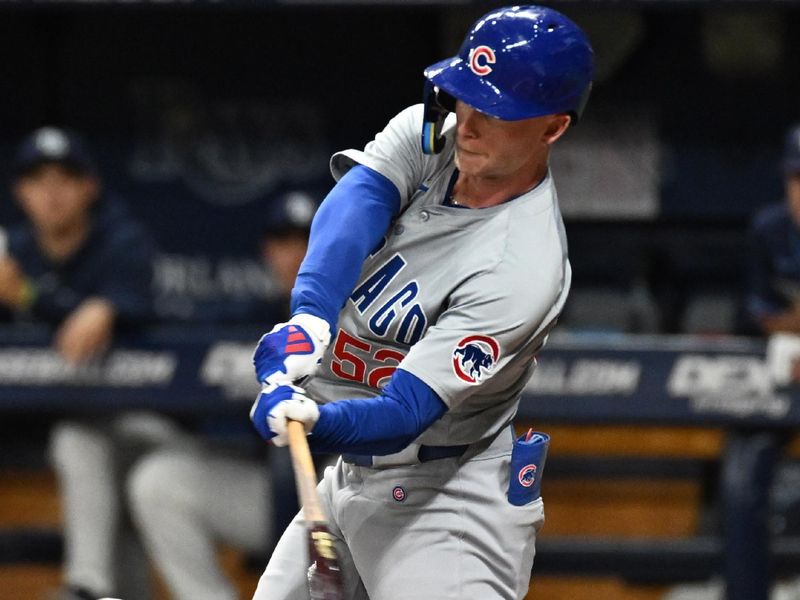 Jun 11, 2024; St. Petersburg, Florida, USA; Chicago Cubs center fielder Pete Crow-Armstrong (52) hits a single in the second inning against the Tampa Bay Rays at Tropicana Field. Mandatory Credit: Jonathan Dyer-USA TODAY Sports