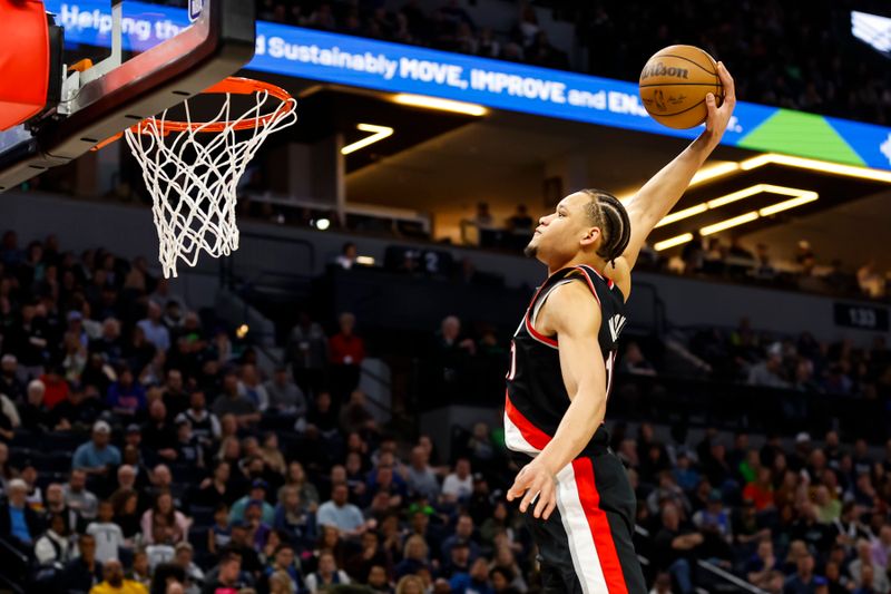 MINNEAPOLIS, MN - APRIL 02: Kevin Knox II #11 of the Portland Trail Blazers goes to the basket for a slam dunk against the Minnesota Timberwolves in the second quarter of the game at Target Center on April 2, 2023 in Minneapolis, Minnesota. NOTE TO USER: User expressly acknowledges and agrees that, by downloading and or using this Photograph, user is consenting to the terms and conditions of the Getty Images License Agreement. (Photo by David Berding/Getty Images)