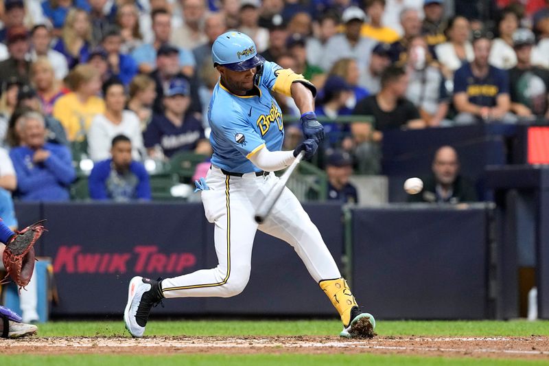 Jun 28, 2024; Milwaukee, Wisconsin, USA;  Milwaukee Brewers right fielder Jackson Chourio (11) hits a grand slam home run during the fourth inning against the Chicago Cubs at American Family Field. Mandatory Credit: Jeff Hanisch-USA TODAY Sports