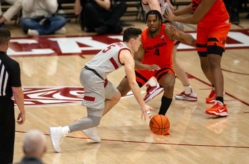 Jan 19, 2023; Stanford, California, USA; Stanford Cardinal guard Michael O'Connell (5) drives around Oregon State Beavers guard Dexter Akanno (4) during the second half at Maples Pavilion. Stanford defeated Oregon State 67-46. Mandatory Credit: D. Ross Cameron-USA TODAY Sports