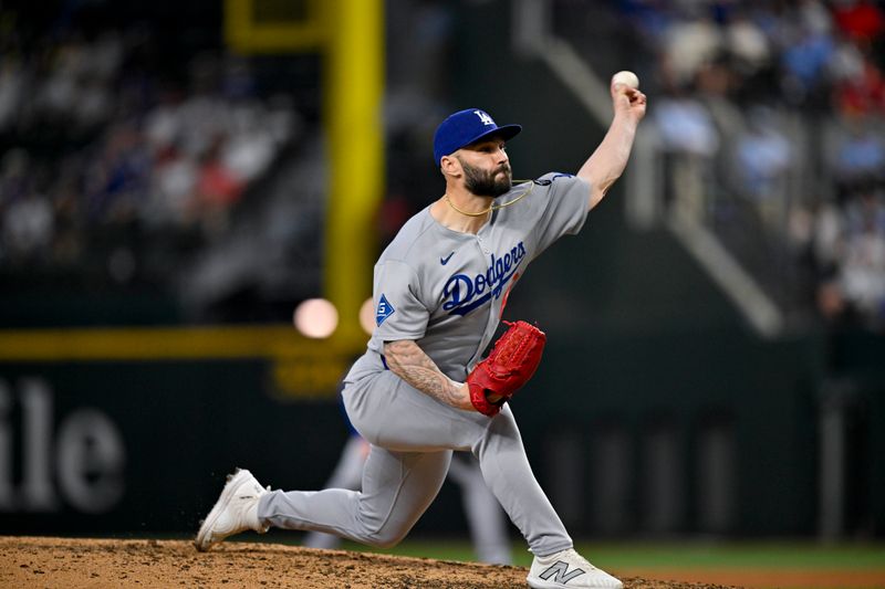Apr 20, 2025; Arlington, Texas, USA; Los Angeles Dodgers relief pitcher Tanner Scott (66) pitches against the Texas Rangers during the ninth inning at Globe Life Field. Mandatory Credit: Jerome Miron-Imagn Images