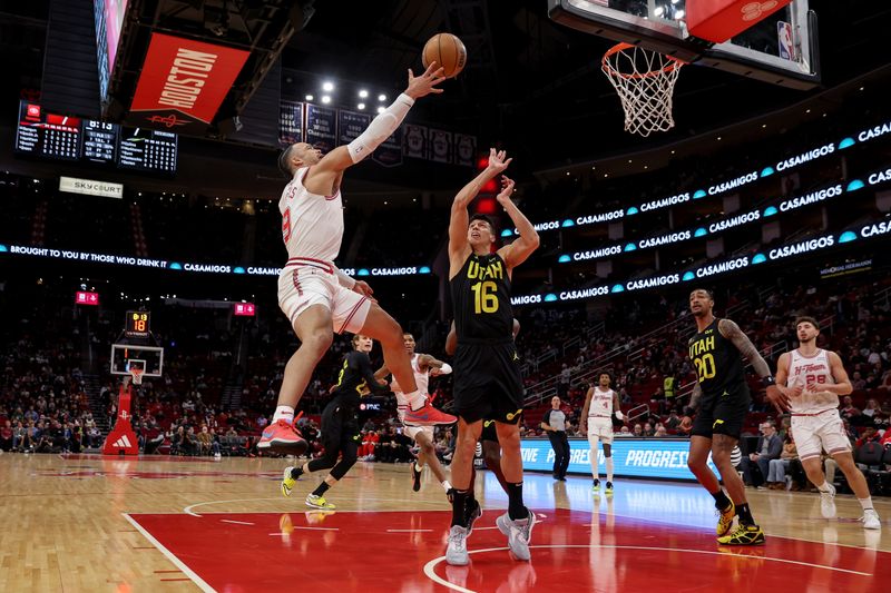 HOUSTON, TEXAS - JANUARY 20: Dillon Brooks #9 of the Houston Rockets shoots the ball in front of Simone Fontecchio #16 of the Utah Jazz in the first half at Toyota Center on January 20, 2024 in Houston, Texas.  NOTE TO USER: User expressly acknowledges and agrees that, by downloading and or using this photograph, User is consenting to the terms and conditions of the Getty Images License Agreement. (Photo by Tim Warner/Getty Images)