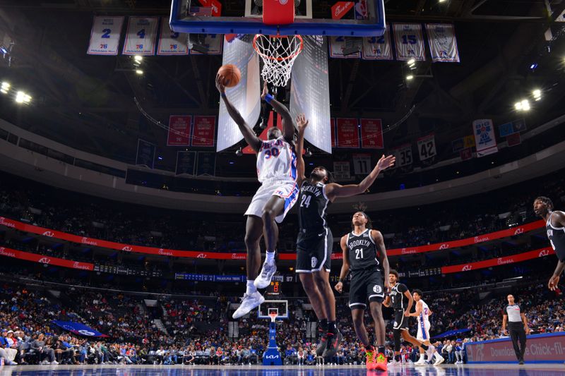 PHILADELPHIA, PA - OCTOBER 16: Adem Bona #30 of the Philadelphia 76ers drives to the basket during the game against the Brooklyn Nets during a NBA preseason game on October 16, 2024 at the Wells Fargo Center in Philadelphia, Pennsylvania NOTE TO USER: User expressly acknowledges and agrees that, by downloading and/or using this Photograph, user is consenting to the terms and conditions of the Getty Images License Agreement. Mandatory Copyright Notice: Copyright 2024 NBAE (Photo by Jesse D. Garrabrant/NBAE via Getty Images)