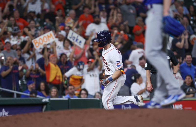 May 17, 2023; Houston, Texas, USA; Fans display signs as Houston Astros center fielder Jake Meyers (6) rounds the bases after hitting a home run during the ninth inning against the Chicago Cubs at Minute Maid Park. Mandatory Credit: Troy Taormina-USA TODAY Sports