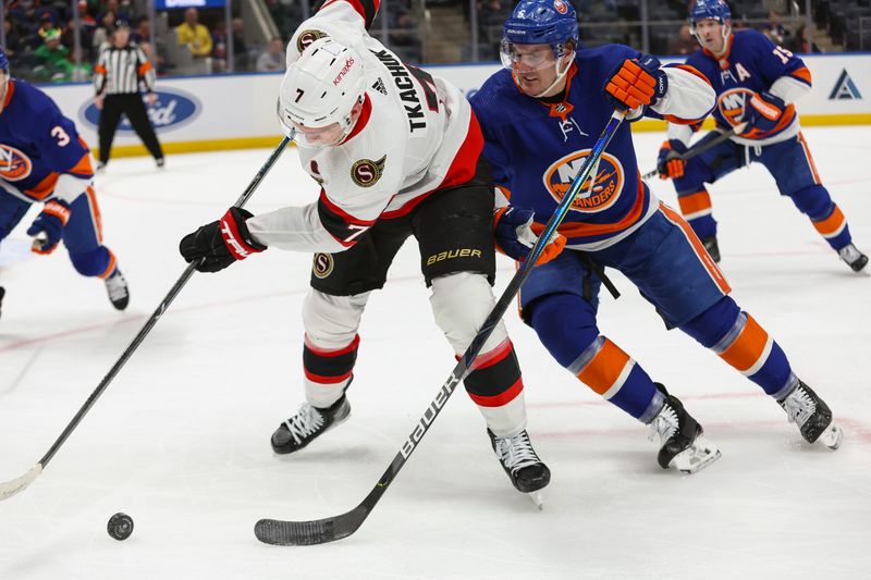 Mar 16, 2024; Elmont, New York, USA;  Ottawa Senators left wing Brady Tkachuk (7) and New York Islanders defenseman Ryan Pulock (6) go for the puck during the first period at UBS Arena. Mandatory Credit: Thomas Salus-USA TODAY Sports