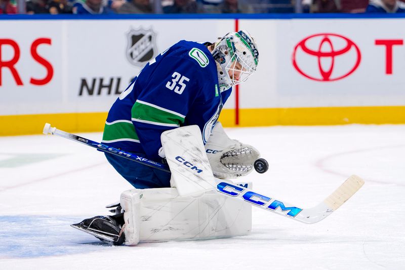 Apr 16, 2024; Vancouver, British Columbia, CAN; Vancouver Canucks goalie Thatcher Demko (35) makes a save against the Calgary Flames in the second period at Rogers Arena. Mandatory Credit: Bob Frid-USA TODAY Sports