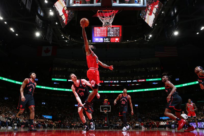 TORONTO, CANADA - JANUARY 31: Coby White #0 of the Chicago Bulls drives to the basket during the game against the Toronto Raptors  on January 31, 2025 at the Scotiabank Arena in Toronto, Ontario, Canada.  NOTE TO USER: User expressly acknowledges and agrees that, by downloading and or using this Photograph, user is consenting to the terms and conditions of the Getty Images License Agreement.  Mandatory Copyright Notice: Copyright 2025 NBAE (Photo by Vaughn Ridley/NBAE via Getty Images)