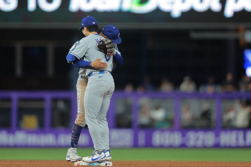 May 5, 2025; Miami, Florida, USA; Los Angeles Dodgers second baseman Hyeseong Kim (6) celebrates with shortstop Mookie Betts (50) after the game against the Miami Marlins at loanDepot Park. Mandatory Credit: Sam Navarro-Imagn Images