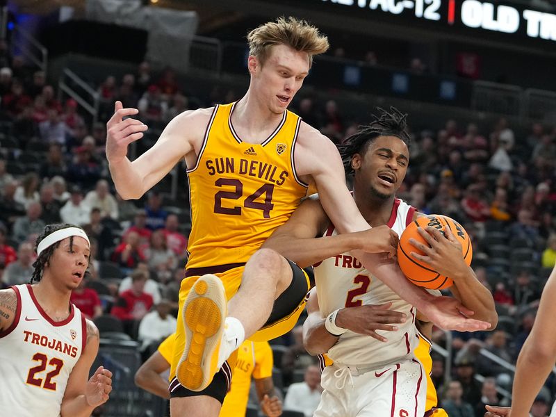 Mar 9, 2023; Las Vegas, NV, USA; Arizona State Sun Devils forward Duke Brennan (24) attempts to steal the ball from USC Trojans guard Reese Dixon-Waters (2) during the first half at T-Mobile Arena. Mandatory Credit: Stephen R. Sylvanie-USA TODAY Sports