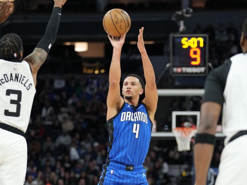 MINNEAPOLIS, MN -  FEBRUARY 3: Jalen Suggs #4 of the Orlando Magic shoots a three point basket during the game against the Minnesota Timberwolves on February 3, 2023 at Target Center in Minneapolis, Minnesota. NOTE TO USER: User expressly acknowledges and agrees that, by downloading and or using this Photograph, user is consenting to the terms and conditions of the Getty Images License Agreement. Mandatory Copyright Notice: Copyright 2022 NBAE (Photo by Jordan Johnson/NBAE via Getty Images)