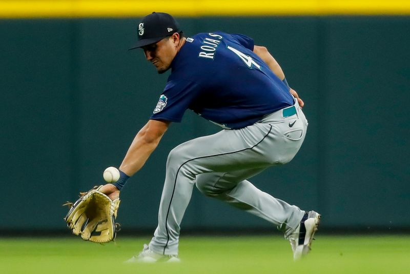 Sep 5, 2023; Cincinnati, Ohio, USA; Seattle Mariners second baseman Josh Rojas (4) attempts to ground the ball hit by Cincinnati Reds third baseman Noelvi Marte (not pictured) in the fifth inning at Great American Ball Park. Mandatory Credit: Katie Stratman-USA TODAY Sports