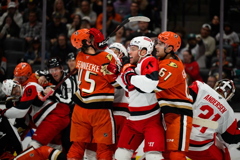 Oct 16, 2025; Anaheim, California, USA; Anaheim Ducks and Carolina Hurricanes players fight after the end of the second period at Honda Center. Mandatory Credit: William Liang-Imagn Images