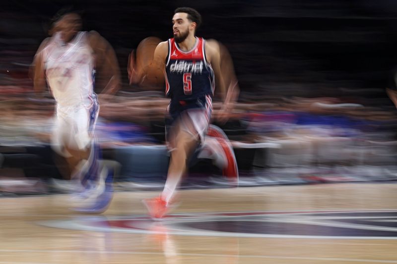 WASHINGTON, DC - FEBRUARY 10: Tyus Jones #5 of the Washington Wizards dribbles against the Philadelphia 76ers during the first half at Capital One Arena on February 10, 2024 in Washington, DC. NOTE TO USER: User expressly acknowledges and agrees that, by downloading and or using this photograph, User is consenting to the terms and conditions of the Getty Images License Agreement.  (Photo by Patrick Smith/Getty Images)