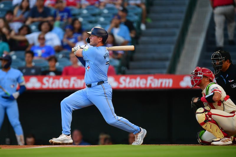 Aug 12, 2024; Anaheim, California, USA; Toronto Blue Jays second baseman Will Wagner (7) hits a double in his major league debut against the Los Angeles Angels during the second inning at Angel Stadium. Mandatory Credit: Gary A. Vasquez-USA TODAY Sports