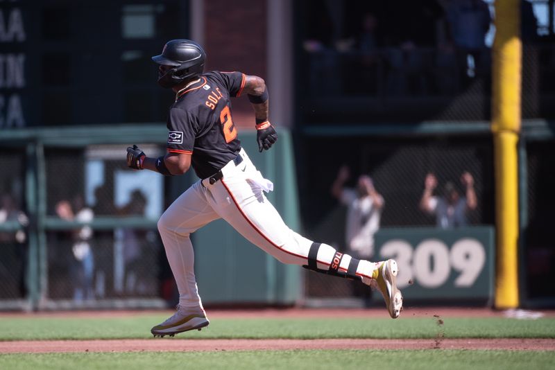 Jun 29, 2024; San Francisco, California, USA; San Francisco Giants designated hitter Jorge Soler (2) runs to second base after hitting a double against the Los Angeles Dodgers during the first inning at Oracle Park. Mandatory Credit: Ed Szczepanski-USA TODAY Sports