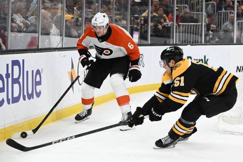 Oct 29, 2024; Boston, Massachusetts, USA; Philadelphia Flyers defenseman Travis Sanheim (6) controls the puck against Boston Bruins center Matthew Poitras (51) during the third period at TD Garden. Mandatory Credit: Brian Fluharty-Imagn Images