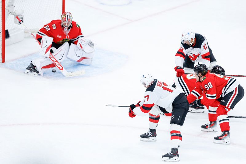Nov 12, 2025; Chicago, Illinois, USA; New Jersey Devils defenseman Simon Nemec (17) shoots and scores against Chicago Blackhawks goaltender Spencer Knight (30) during the second period at United Center. Mandatory Credit: Kamil Krzaczynski-Imagn Images Nov 12, 2025; Chicago, Illinois, USA; New Jersey Devils defenseman Simon Nemec (17) shoots and scores against Chicago Blackhawks goaltender Spencer Knight (30) during the second period at United Center. Mandatory Credit: Kamil Krzaczynski-Imagn Images