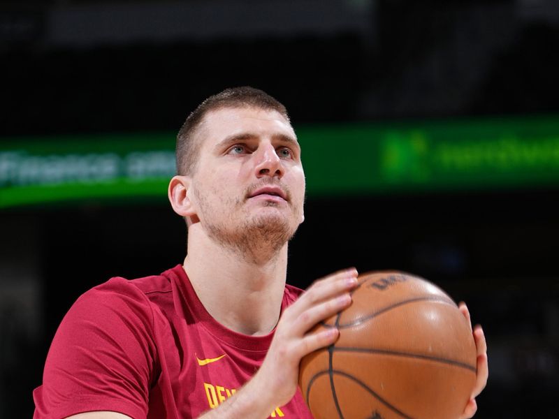 DENVER, CO - JANUARY 27: Nikola Jokic #15 of the Denver Nuggets warms up before the game against the Philadelphia 76ers on January 27, 2024 at the Ball Arena in Denver, Colorado. NOTE TO USER: User expressly acknowledges and agrees that, by downloading and/or using this Photograph, user is consenting to the terms and conditions of the Getty Images License Agreement. Mandatory Copyright Notice: Copyright 2024 NBAE (Photo by Garrett Ellwood/NBAE via Getty Images)