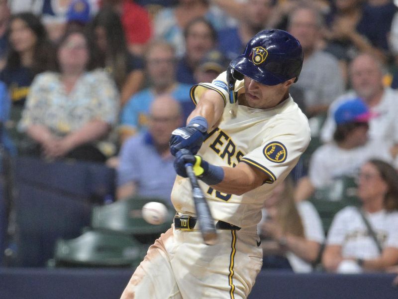 Jul 29, 2024; Milwaukee, Wisconsin, USA; Milwaukee Brewers outfielder Sal Frelick (10) gets a base hit against the Atlanta Braves in the eighth innning at American Family Field. Mandatory Credit: Michael McLoone-USA TODAY Sports