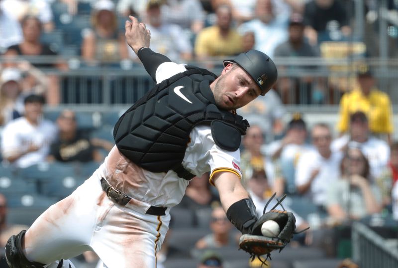 Jul 7, 2024; Pittsburgh, Pennsylvania, USA;  Pittsburgh Pirates catcher Joey Bart (14) attempts to catch a foul pop-up against New York Mets shortstop Francisco Lindor (not pictured) during the sixth inning at PNC Park. Bart dropped the ball. The Mets won 3-2. Mandatory Credit: Charles LeClaire-USA TODAY Sports