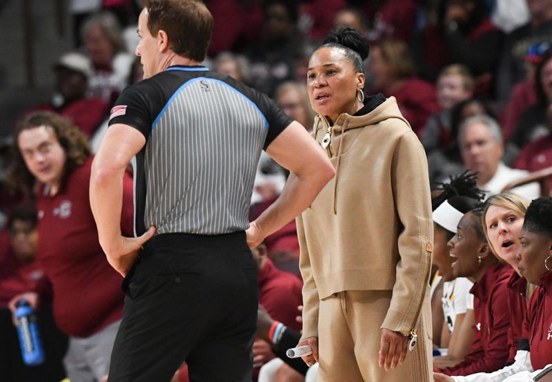 Mar 24, 2034; Columbia, So Carolina, USA;  South Carolina Coach Dawn Staley talks with a referee during the first quarter of the second round NCAA Women's Basketball Tournament game with University of North Carolina  at the Colonial Life Center.  Mandatory Credit: Ken Ruinard-USA TODAY Sports via Greenville News