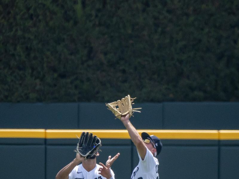 Aug 5, 2023; Detroit, Michigan, USA; Detroit Tigers right fielder Kerry Carpenter (30) runs down a fly ball in front of center fielder Riley Greene (31) in the first inning against the Tampa Bay Raysat Comerica Park. Mandatory Credit: David Reginek-USA TODAY Sports