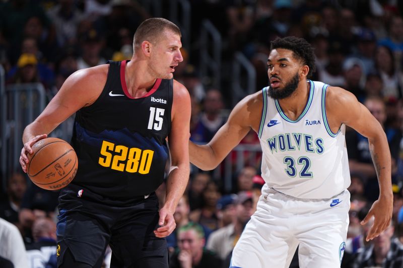 DENVER, CO - MAY 19:  Karl-Anthony Towns #32 of the Minnesota Timberwolves plays defense during the game  against Nikola Jokic #15 of the Denver Nuggets during Round 2 Game 7 of the 2024 NBA Playoffs  on May 19, 2024 at the Ball Arena in Denver, Colorado. NOTE TO USER: User expressly acknowledges and agrees that, by downloading and/or using this Photograph, user is consenting to the terms and conditions of the Getty Images License Agreement. Mandatory Copyright Notice: Copyright 2024 NBAE (Photo by Garrett Ellwood/NBAE via Getty Images)