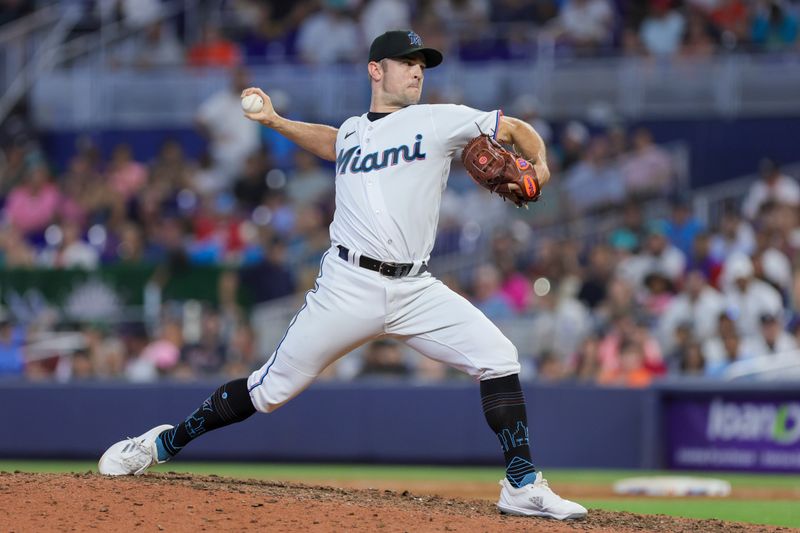 Jul 30, 2023; Miami, Florida, USA; Miami Marlins relief pitcher David Robertson (19) delivers a pitch against the Detroit Tigers during the ninth inning at loanDepot Park. Mandatory Credit: Sam Navarro-USA TODAY Sports