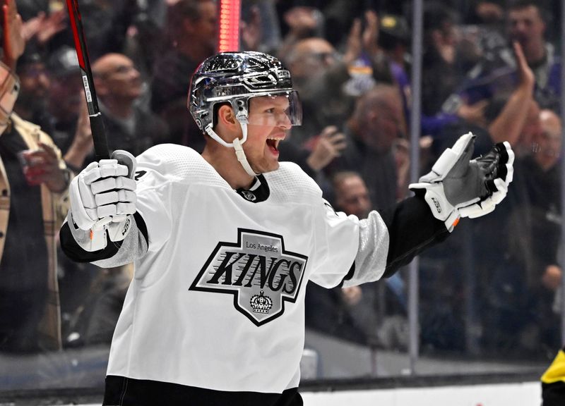 Apr 10, 2023; Los Angeles, California, USA;  Los Angeles Kings right wing Arthur Kaliyev (34) celebrates after scoring a goal in the second period against the Vancouver Canucks at Crypto.com Arena. Mandatory Credit: Jayne Kamin-Oncea-USA TODAY Sports