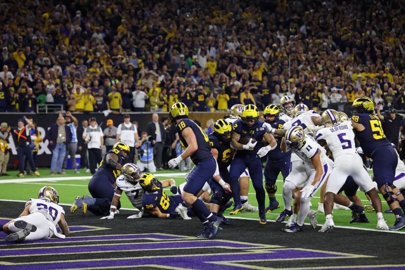 Jan 8, 2024; Houston, TX, USA; Michigan Wolverines running back Blake Corum (2) scores a touchdown against the Washington Huskies during the fourth quarter in the 2024 College Football Playoff national championship game at NRG Stadium. Mandatory Credit: Thomas Shea-USA TODAY Sports