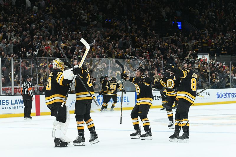 Oct 9, 2025; Boston, Massachusetts, USA; Boston Bruins goaltender Joonas Korpisalo (70) reacts with his teammates after defeating the Chicago Blackhawks in overtime at TD Garden. Mandatory Credit: Bob DeChiara-Imagn Images