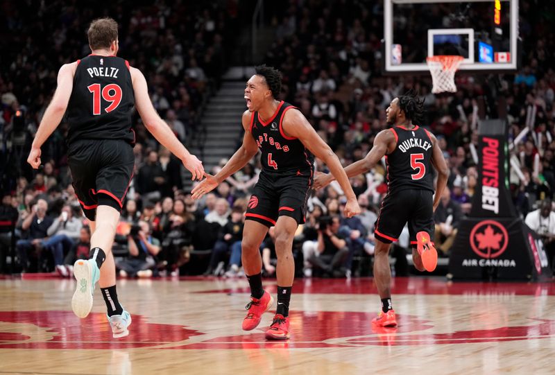 TORONTO, ON - FEBRUARY 10: Scottie Barnes #4 of the Toronto Raptors celebrates with Jakob Poeltl #19 and Immanuel Quickley #5 against the Cleveland Cavaliers during the second half of their basketball game at the Scotiabank Arena on February 10, 2024 in Toronto, Ontario, Canada. NOTE TO USER: User expressly acknowledges and agrees that, by downloading and/or using this Photograph, user is consenting to the terms and conditions of the Getty Images License Agreement. (Photo by Mark Blinch/Getty Images)