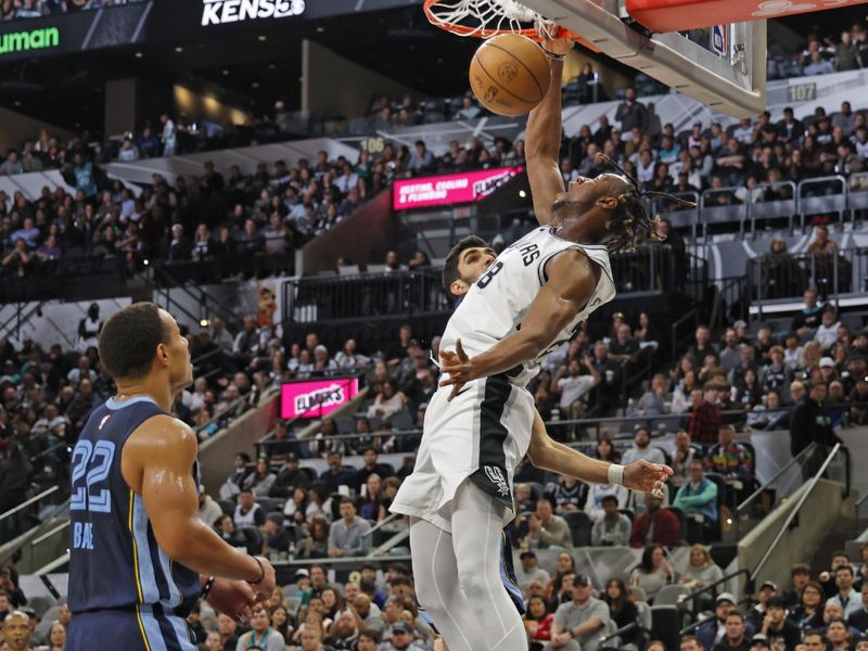 SAN ANTONIO, TX - JANUARY 17: Charles Bassey #28 of the San Antonio Spurs dunks against the Memphis Grizzlies in the first half at Frost Bank Center on January 17, 2025 in San Antonio, Texas. NOTE TO USER: User expressly acknowledges and agrees that, by downloading and or using this photograph, User is consenting to terms and conditions of the Getty Images License Agreement. (Photo by Ronald Cortes/Getty Images)